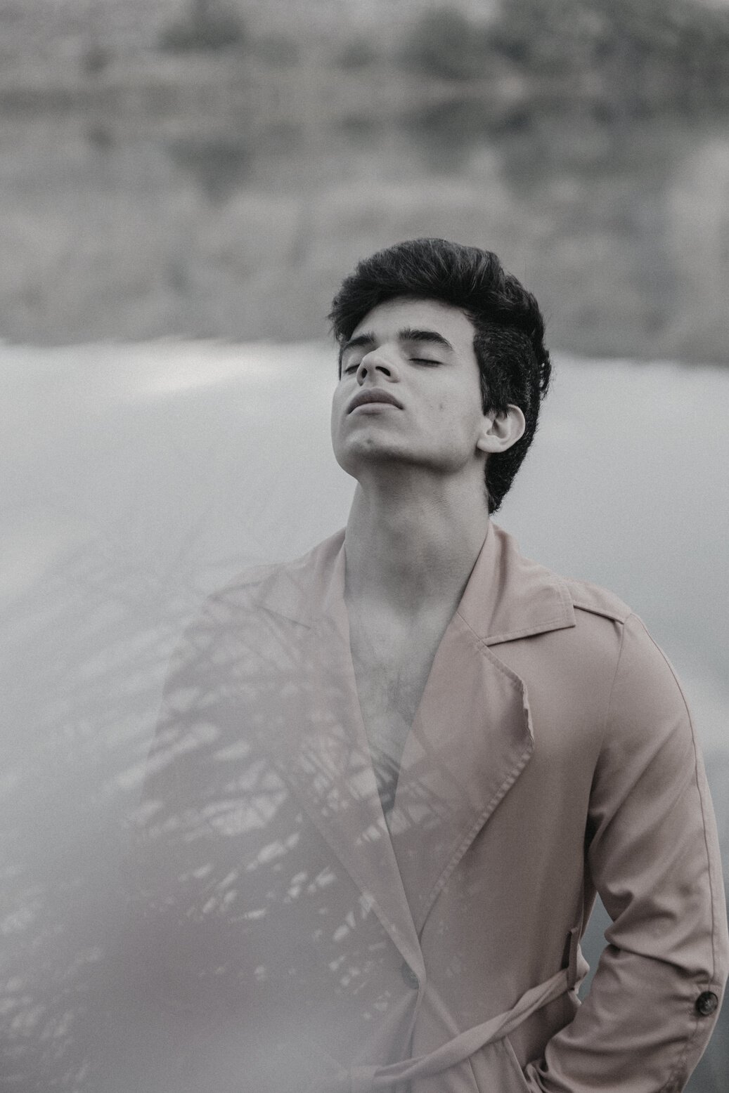 Man in Pastel Orange Shirt Near the Lake