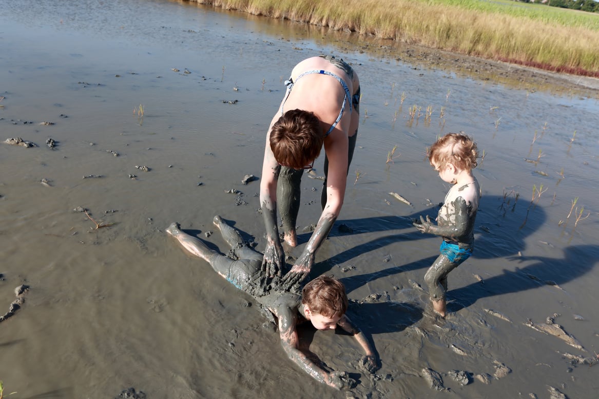 Woman and Two Children in Healing Mud